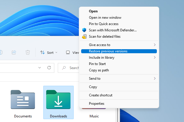 Using the "Restore previous versions" option on the Downloads folder