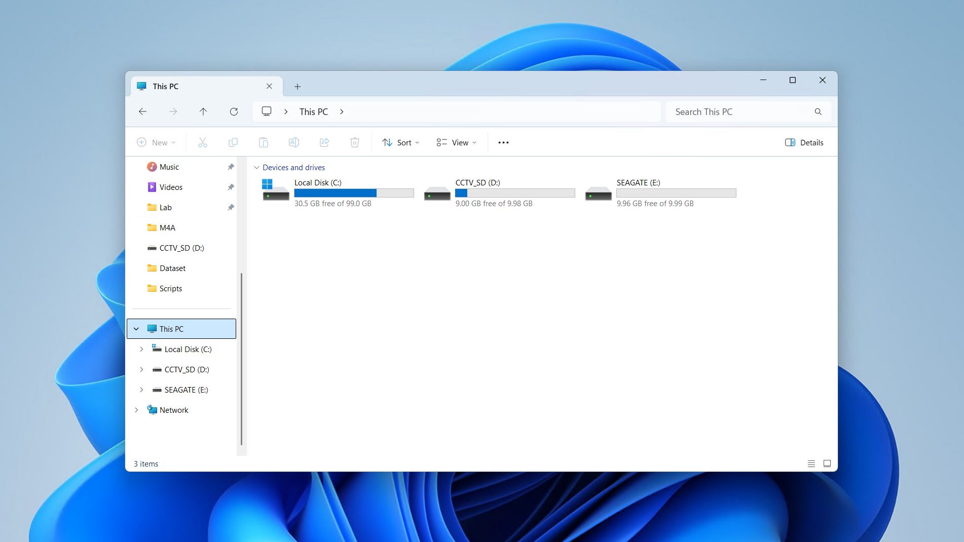 Finding the Seagate external hard drive under This PC in File Explorer.